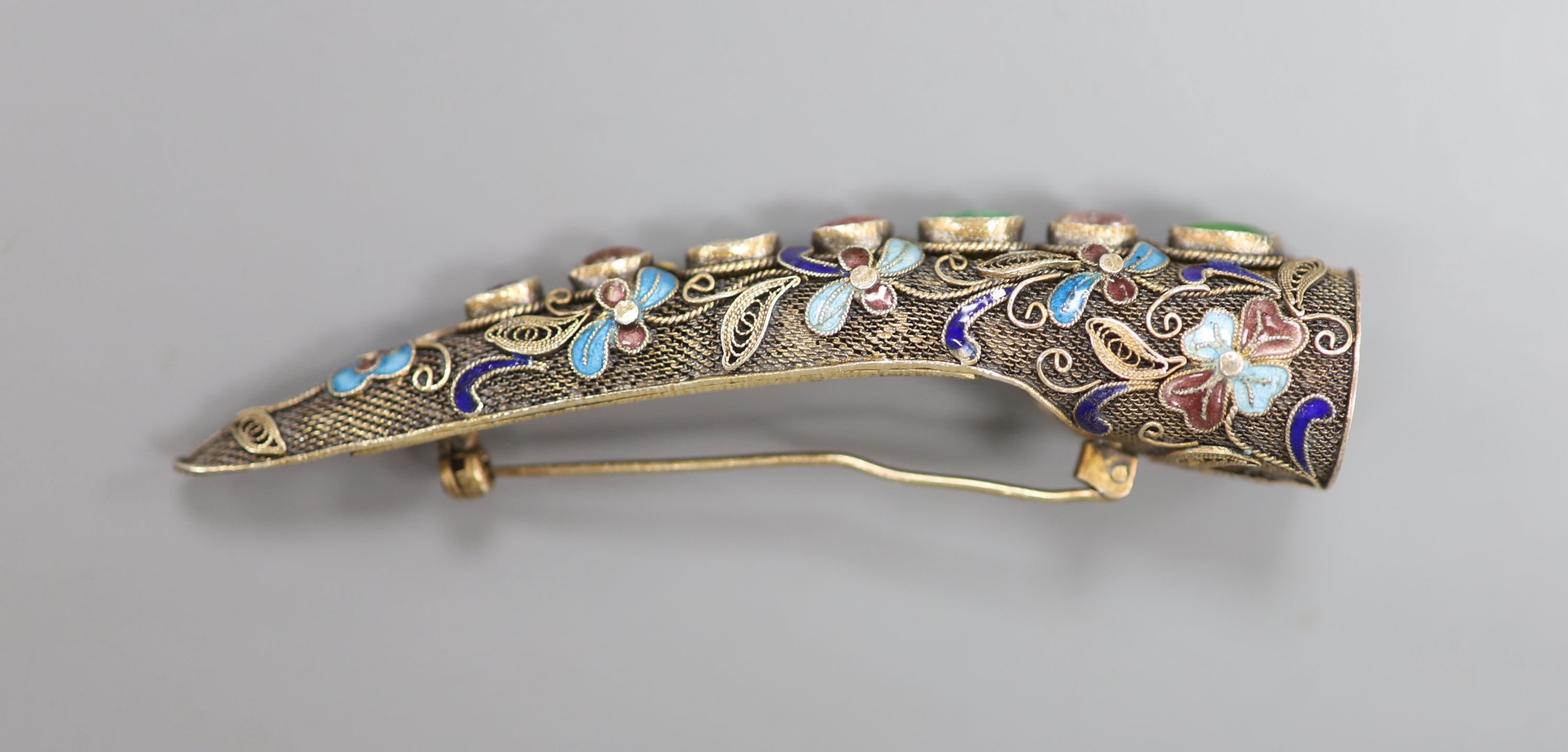 A late 19th/early 20th century Chinese filigree white metal, enamel and gem set nail guard brooch, 85mm.